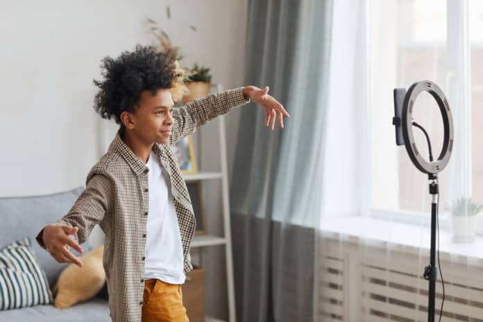 A teenager filming a video